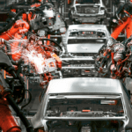 Robotic arms welding car parts with lean tools in automotive production