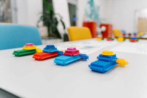 colorful building blocks on a table used for lean manufacturing game simulation