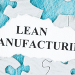 Puzzle with torn paper displaying "Lean Manufacturing" as part of 5S Lean Production.