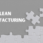 Lean manufacturing definitions illustrated by a gray-background puzzle with one missing white piece beside the headline “Lean Manufacturing.”