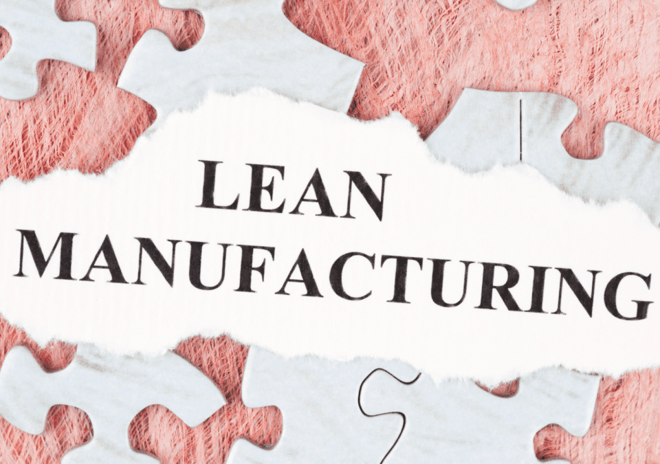 Torn paper revealing the phrase "Lean Manufacturing" surrounded by puzzle pieces, symbolizing the concept of 5S lean production.