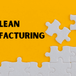 Lean operations training visual with puzzle pieces and the phrase “Lean Manufacturing” on a yellow background.
