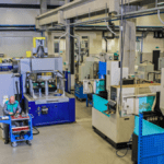 Modern machine shop arranged according to lean management principle for efficient flow.