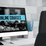 Desktop computer displaying an ‘ONLINE COURSES’ portal for lean training courses in a modern office setting.”