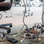 tangled cables in office space illustrating poor organization prior to teamwork training