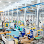 busy manufacturing floor with machinery and staff working in harmony after teamwork training