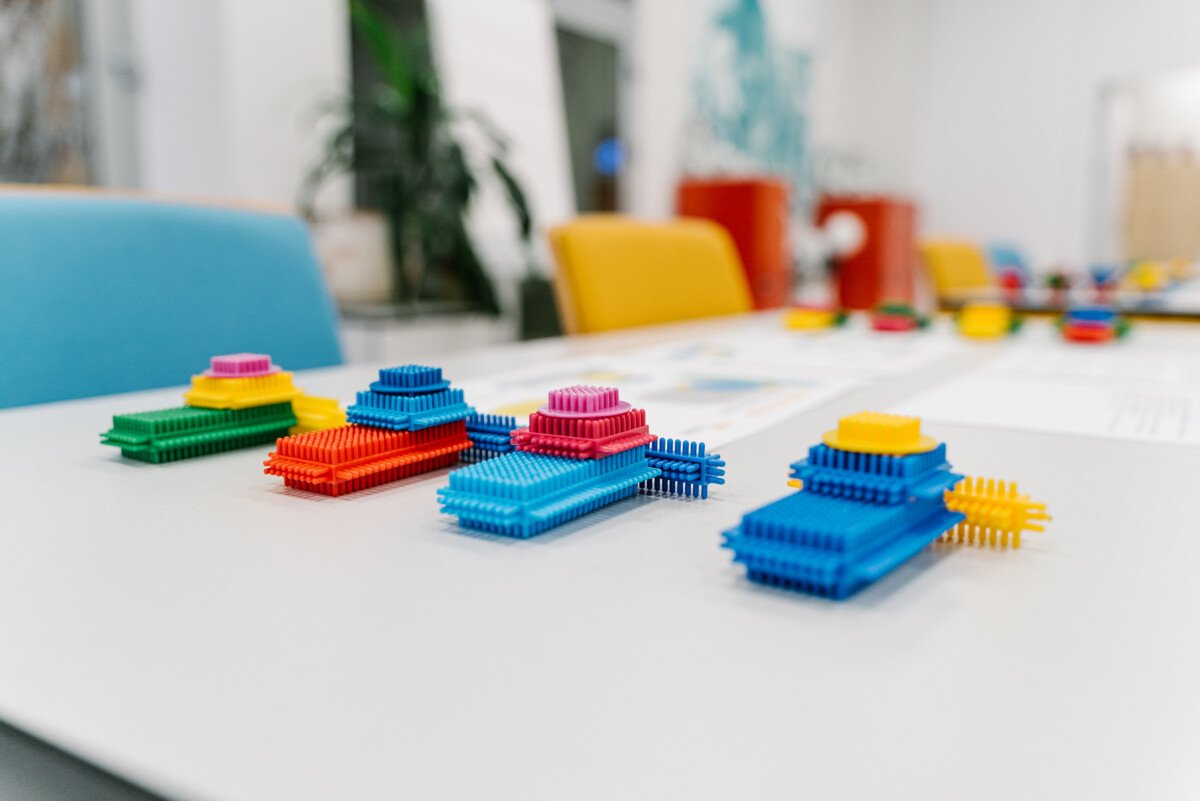 colorful building blocks on a table used for lean manufacturing game simulation