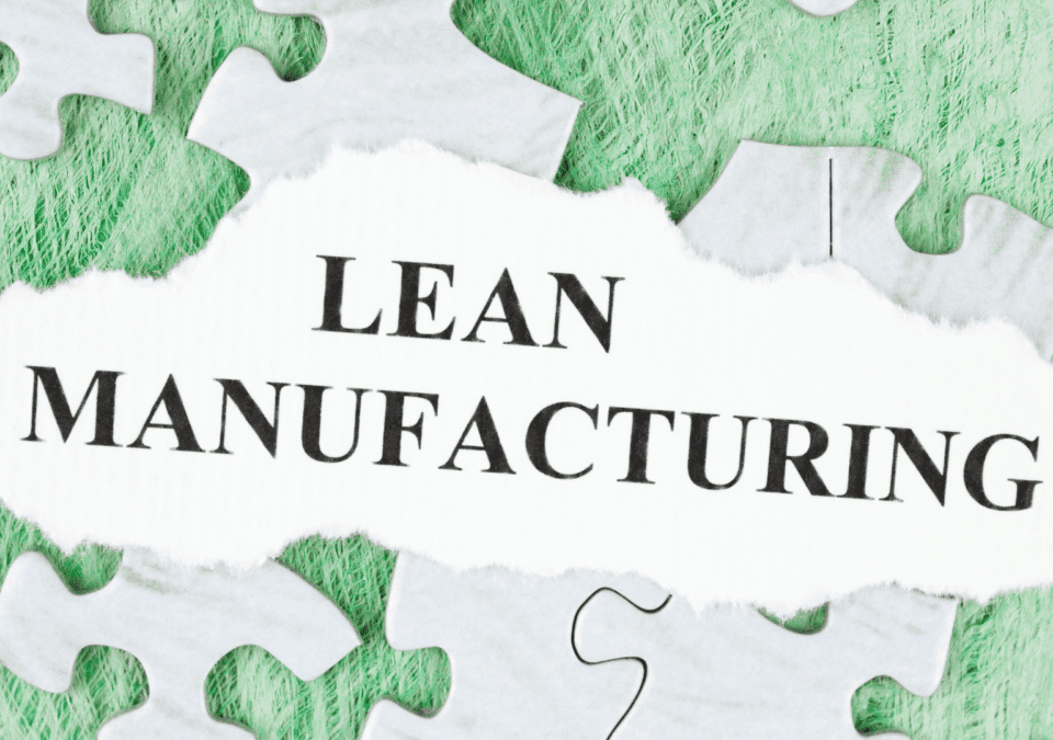 Lean Manufacturing concept on torn paper surrounded by puzzle pieces, symbolizing systematic approaches like 5S Checklists.