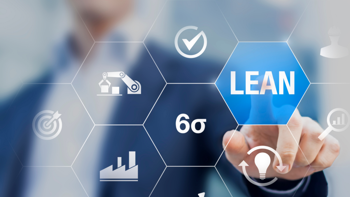 Businessman interacting with digital interface displaying icons related to Lean, Six Sigma, and productivity – relevant to the definition of 5S methodology.