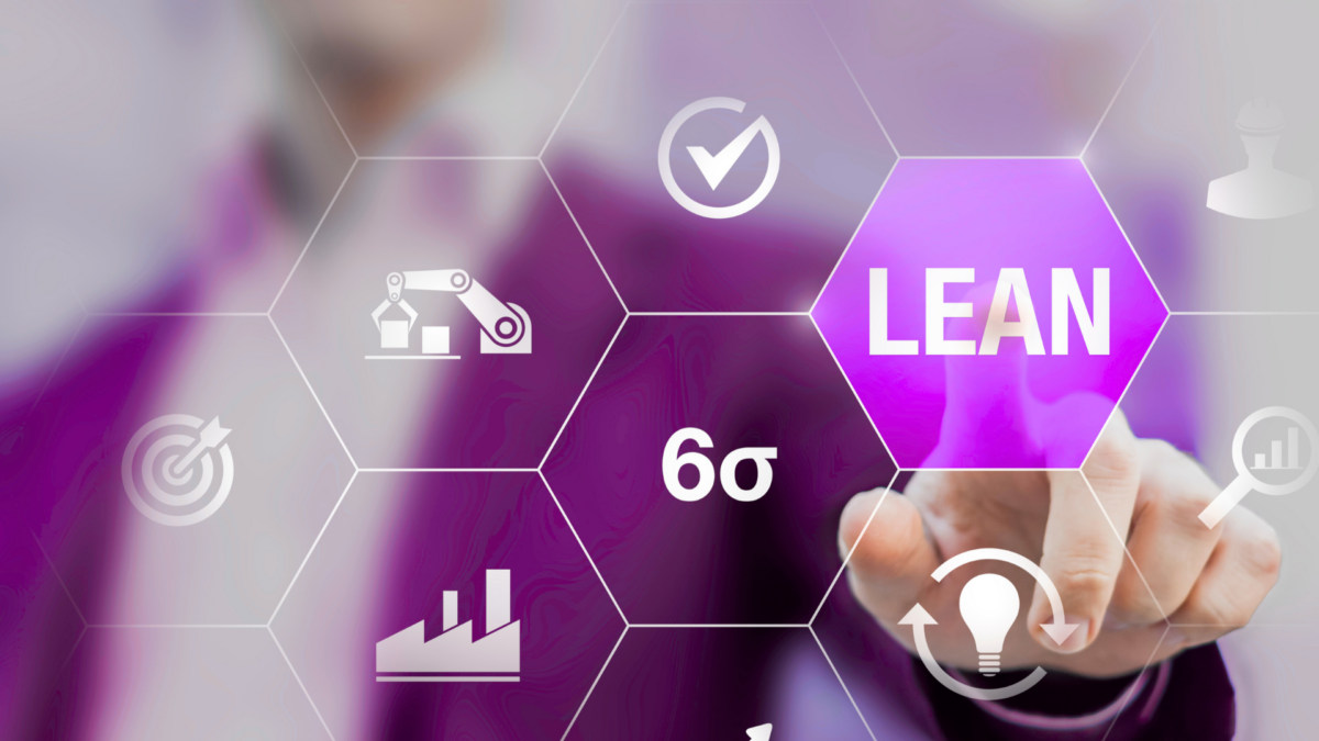 Businessperson interacting with Lean and Six Sigma icons on a virtual screen – Visual Management concept