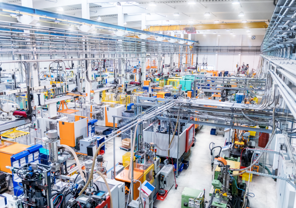 Modern production hall showcasing organized machinery and equipment aligned with The Lean 5S Method principles.