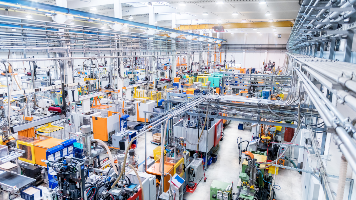 Modern production hall showcasing organized machinery and equipment aligned with The Lean 5S Method principles.