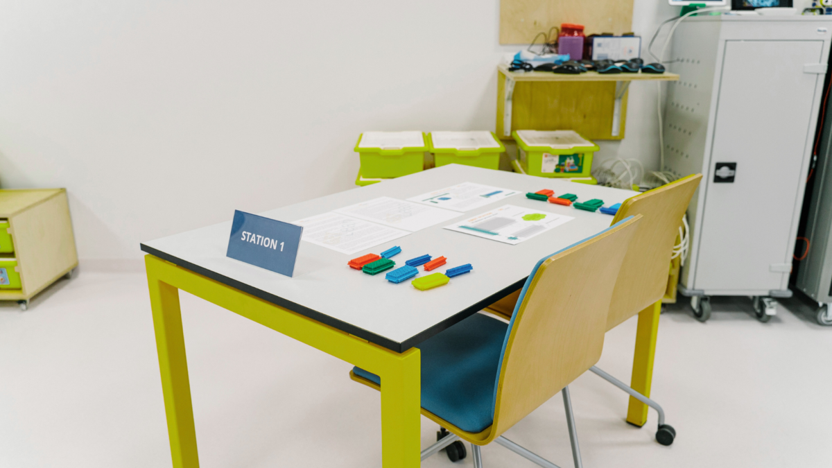 Hands-on activity during a workshop using colorful blocks in one of the free Lean games.