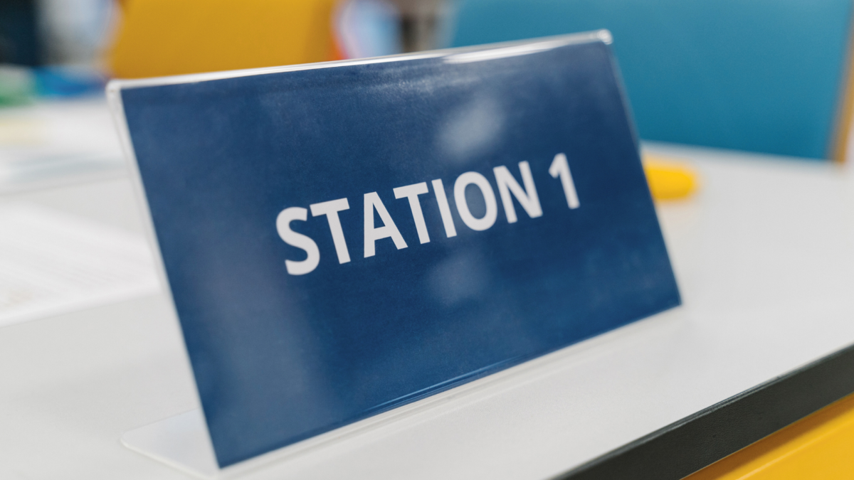 Lean Games and Simulations – Station 1 sign prepared for a hands-on Lean training session. 