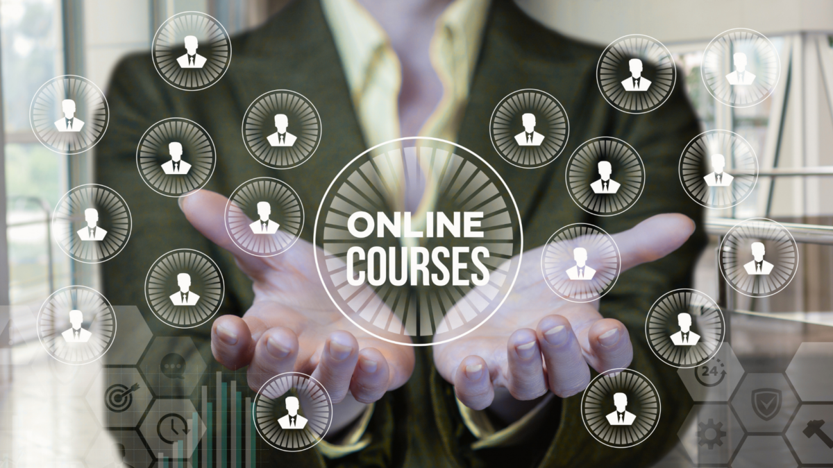 Business professional presenting a network of icons and the phrase ‘Online Courses,’ symbolizing digital education in courses in Lean Manufacturing