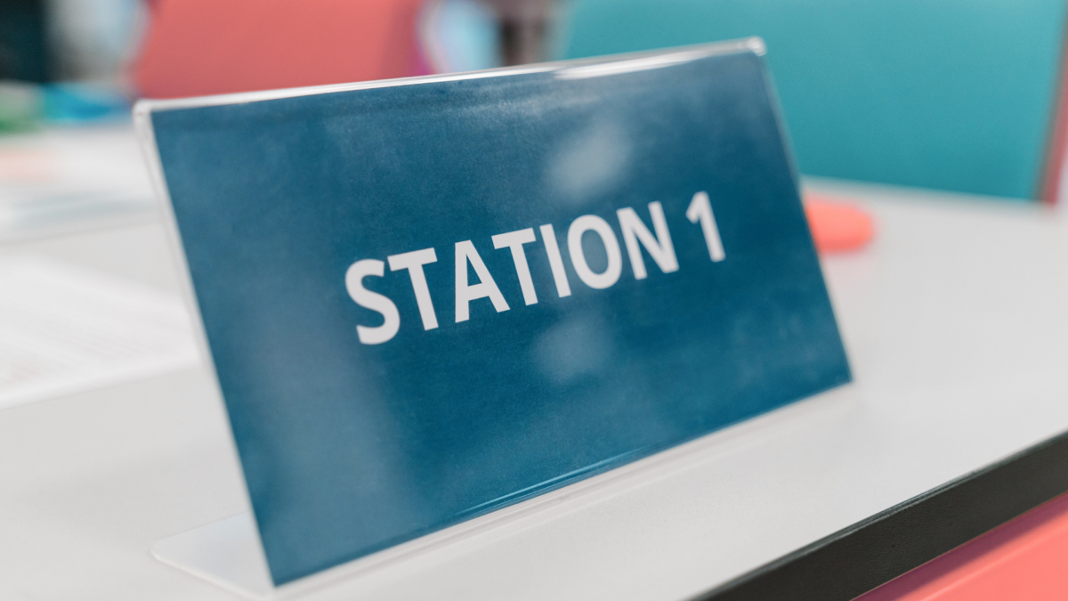 Station 1 marker used during lean games to designate workstations in simulation exercises. 