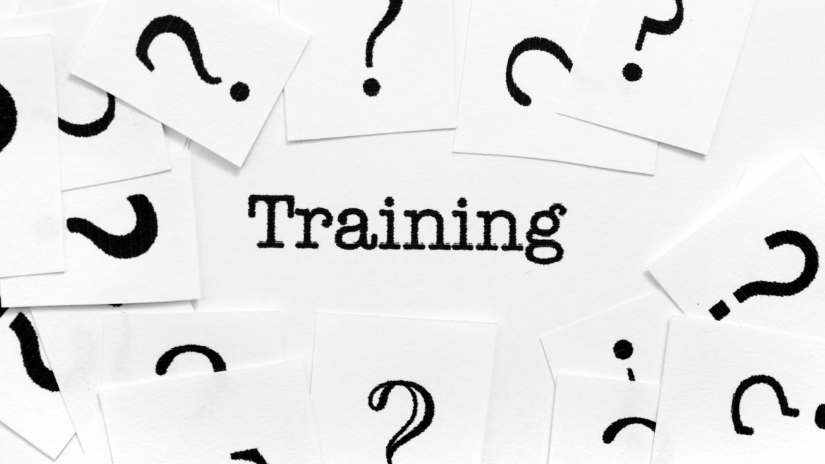 Word ‘Training’ surrounded by black question marks on white cards, symbolizing the search for Lean Manufacturing Certification knowledge.”
